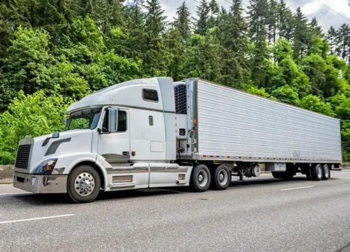 American Eagle Freight Inc 14 Certified freight professional inspecting documentation or securing cargo during shipment prep.